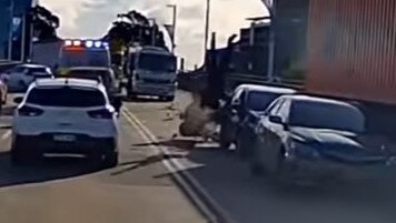 The motorbike driver is sent flying after crashing into the car. Picture: Dash Cam Owners of Australia