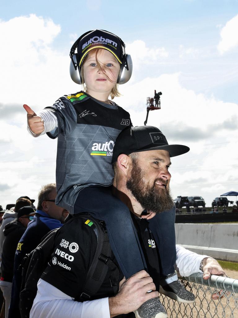 Harvey gets a prime view on top of dad’s Simon Thompson’s shoulders to watch the racing at The Bend on Sunday. Picture SARAH REED