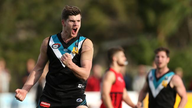 Nick Daisley celebrates his goal late in the last quarter which sealed the victory. Picture: Hamish Blair