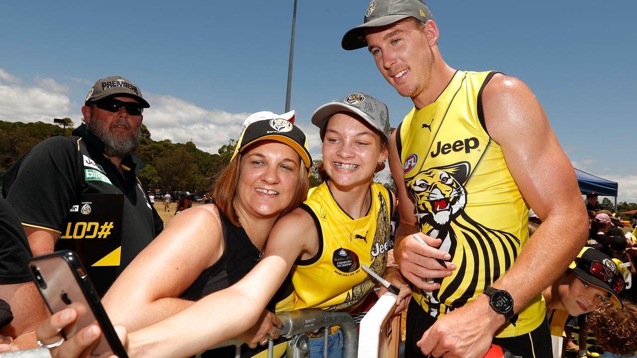 Tom Lynch poses for a picture with fans on the Gold Coast.