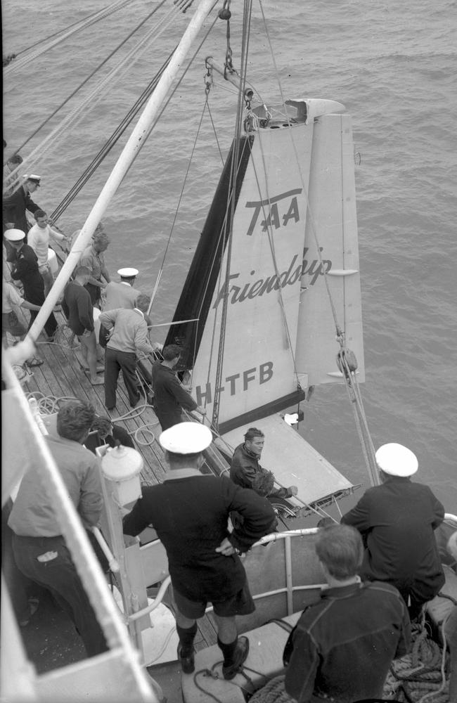 Tail Assembly of the Fokker Friendship which crashed killing 29 on board dragged from the seabed off Mackay being secured by crew members of HMAS Warrego. Picture by Norm Lee