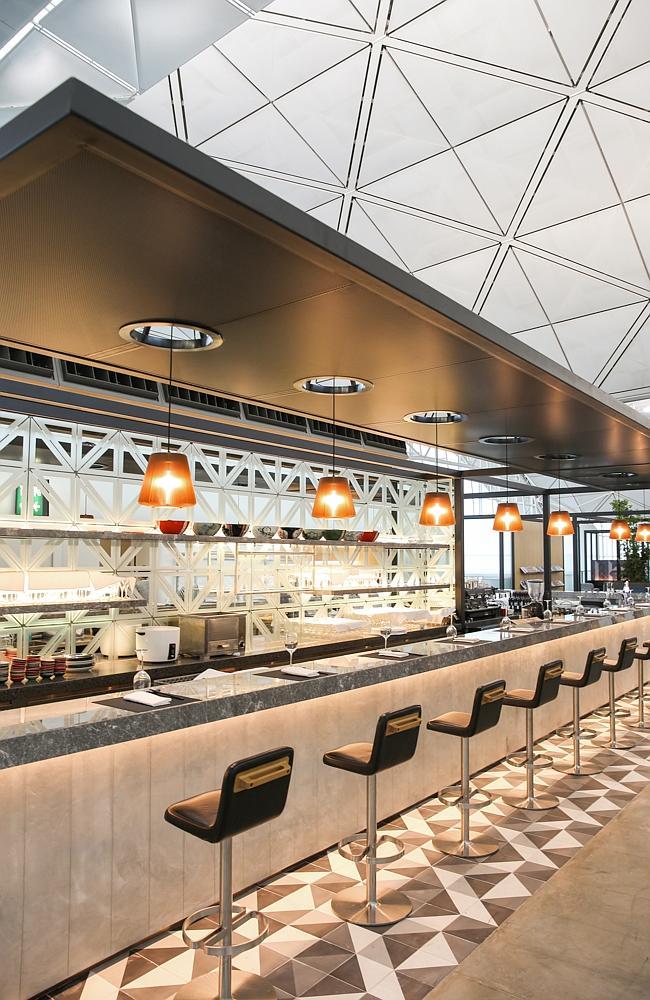 The bar area boasts views across the airport along with cocktails, wines and barista-made coffees.