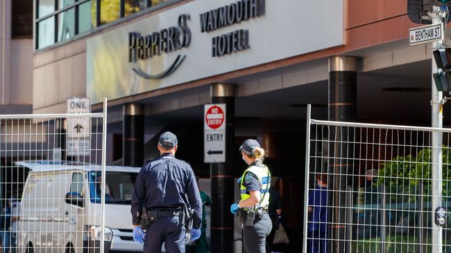 Police officers guarding the Peppers Waymouth Hotel in Adelaide. Picture: Matt Turner