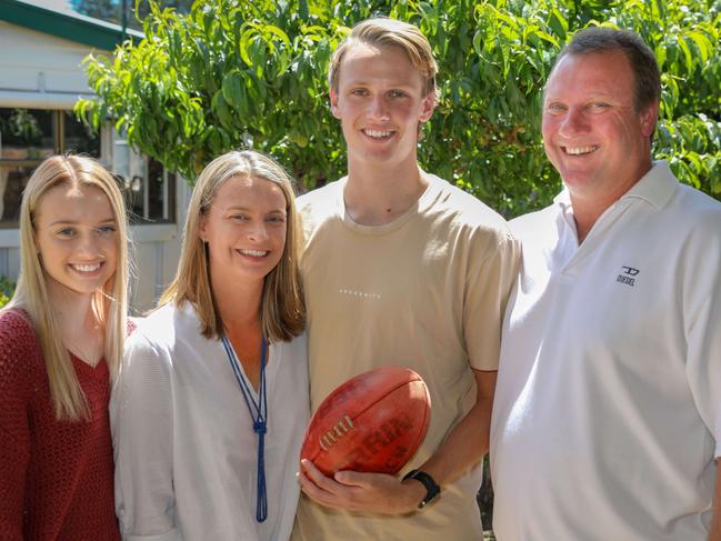 ADV News:  Top SA AFL Draft candidate Jack Lukosius with his family, dad Rob, mum Heather and sister Abbey at the Grange home..(AAP Image/Russell Millard) NO ARCHIVING