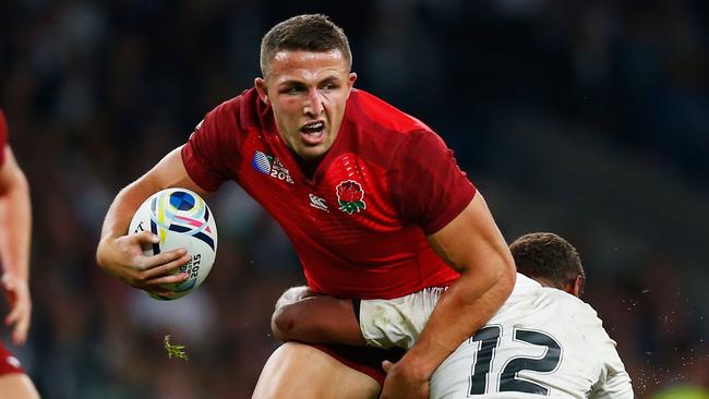 LONDON, ENGLAND - SEPTEMBER 18: Sam Burgess of England is tackled by Gabiriele Lovobalavu of Fiji during the 2015 Rugby World Cup Pool A match between England and Fiji at Twickenham Stadium on September 18, 2015 in London, United Kingdom. (Photo by Mike Hewitt/Getty Images)