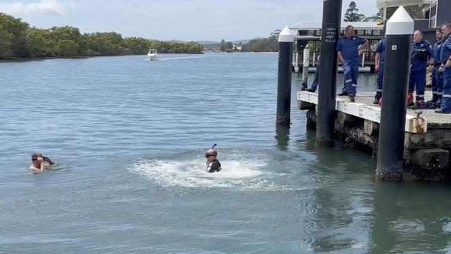 Police divers searching the water at Woy Woy. Picture: TNV