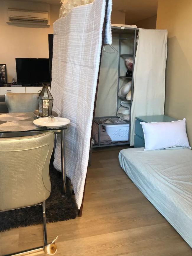 The room contains a mattress on the floor and a makeshift wardrobe. Picture: Airbnb