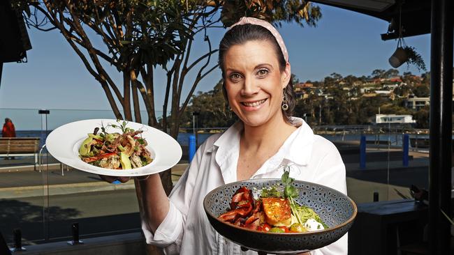 Front of house manager at Robbie Brown's at Kingston, Erin Webb with their seafood salad and “Keto Breaky”. Picture: Zak Simmonds