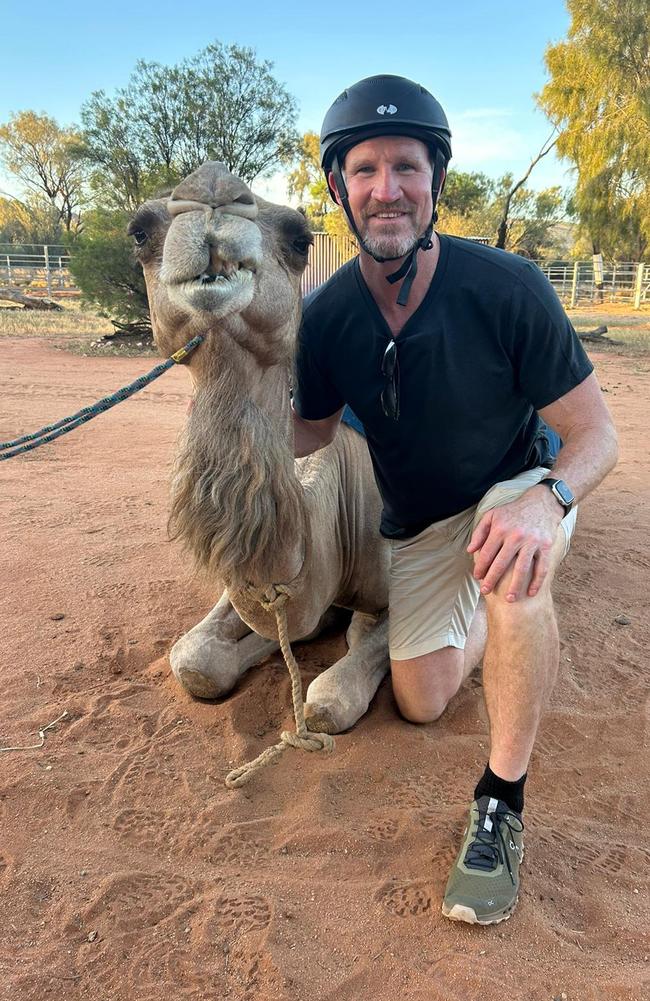 Nathan Buckley with Pixie, Pyndan Camel Tracks during his recent visit to Alice Springs after being named the ambassador for the upcoming Alice Springs Masters Games. Picture: Supplied