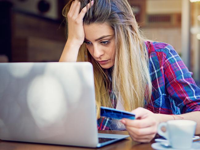 Young girl have problems with her credit card till shopping online. istock photo