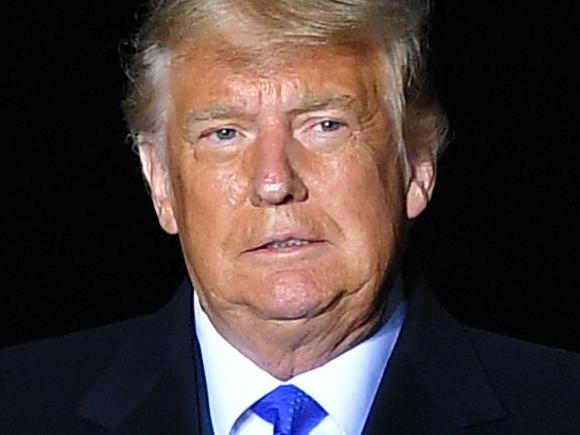 US President Donald Trump arrives to speak during a campaign rally at Waukesha County Airport in Waukesha, Wisconsin on October 24, 2020. (Photo by MANDEL NGAN / AFP)