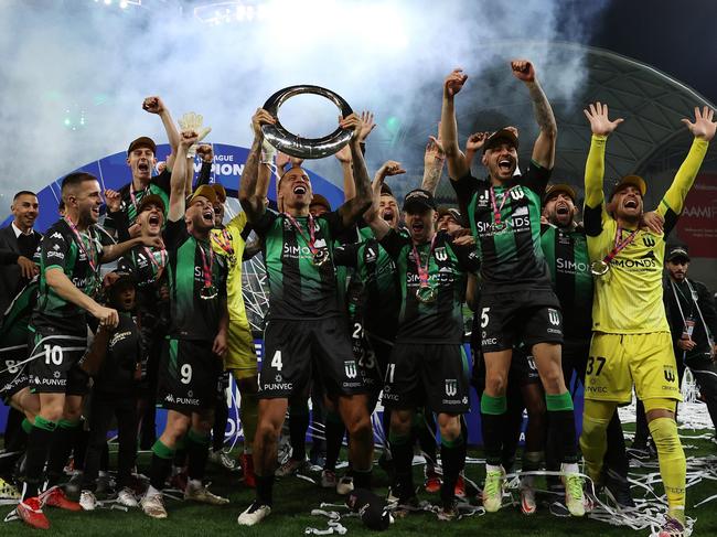 MELBOURNE, AUSTRALIA - MAY 28: Leo Lacroix of Western United holds the trophy aloft during the A-League Mens Grand Final match between Western United and Melbourne City at AAMI Park on May 28, 2022, in Melbourne, Australia. (Photo by Robert Cianflone/Getty Images)