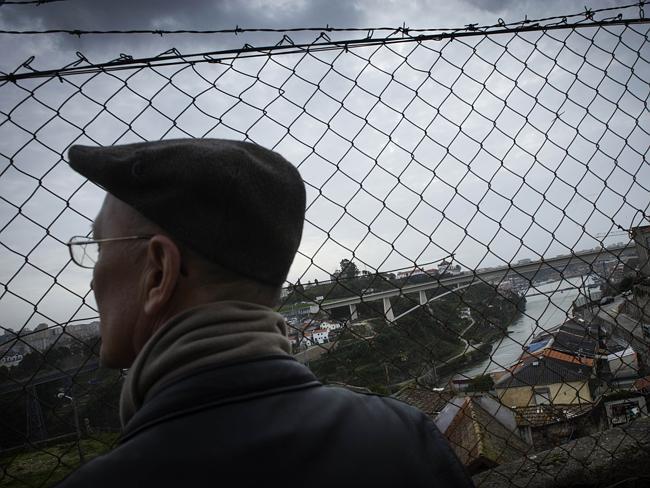 US tourist Dean Watson looks at the course of the Douro river in Porto. Picture: AFP