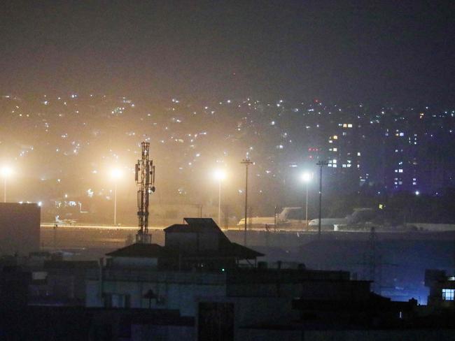 Planes are seen on the tarmac at the airport in Kabul late on August 30, 2021, hours ahead of a US deadline to complete its frenzied withdrawal from Afghanistan. Picture: AFP