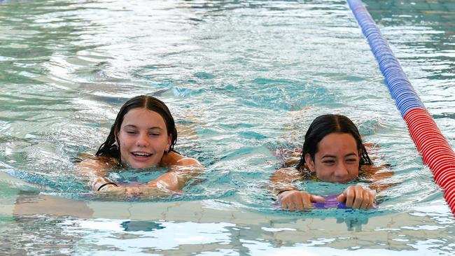 Chloe Reader and Macey Sheridan of Darwin Swimming Club at the 2023 Country Swimming Championships at Parap Pool, Darwin. Picture: Pema Tamang Pakhrin