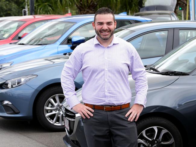 No wonder he’s smiling ... Luke Camilleri from Grand Prix Mazda is just one of many car salesman reporting increased interest following the recent Federal Budgte changes. Picture: Darren England