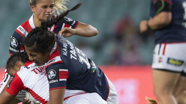 Shakiah Tungai of the Dragons is tackled during the NRLW game against the Roosters.