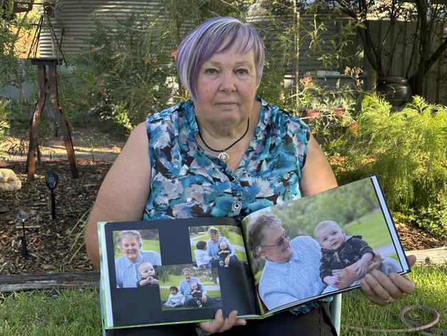 Glenda Black holds a photo album of her beloved mother Wilma Wippell. Picture: Abby Walter