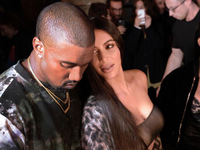 Kanye West with Kim Kardashian. Kardashian has rarely been spotted in public since she was held up at gunpoint in Paris back in early October. Picture: AFP/Alain Jocard