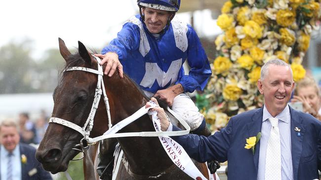 Hugh Bowman gives Winx a pat on the head after her win in the George Ryder Stakes. Picture: AAP