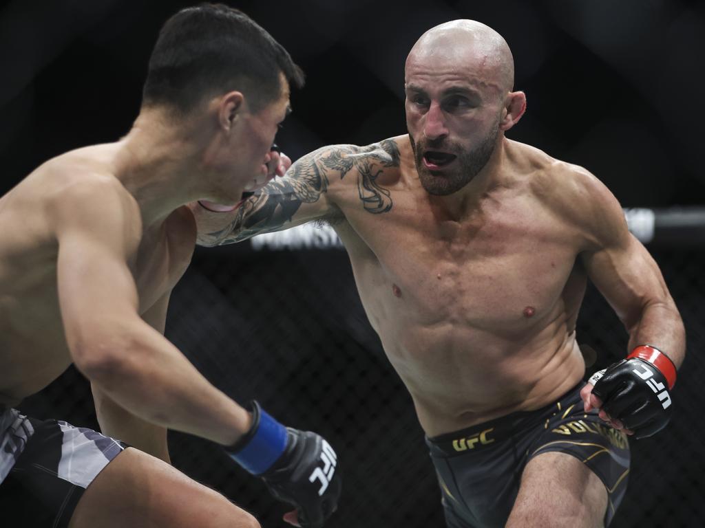 Alexander Volkanovski of Australia punches Chan Sung Jung.