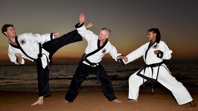 Tang Soo Tao Martial Artists Nathan Franklin, Alan Holand and Meranda Thatcher posing for a photo commemorating the studio’s 40th anniversary back in 2014.