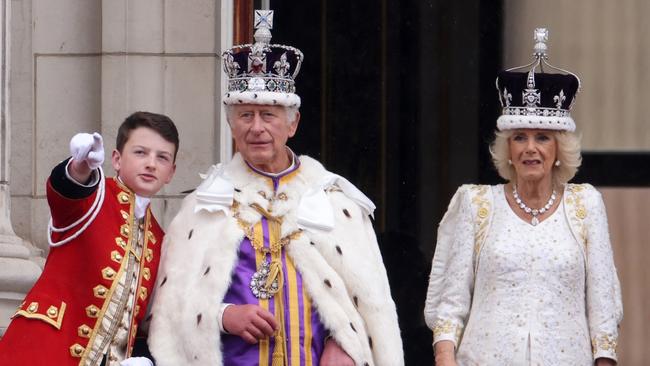 King Charles III and Queen Camilla on the Buckingham Palace balcony during the flypast after their coronation. Picture: Getty Images.