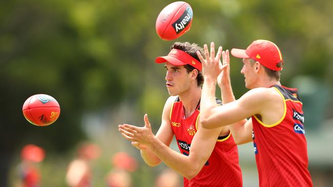 Ben King and Jack Lukosius on the track during Gold Coast pre-season.