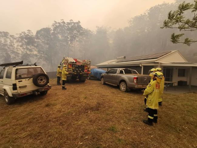 The Nambucca Heads and Macksville fireys fought to protect this property at Congarini before the tree crashed onto the truck as they left. Picture: Supplied