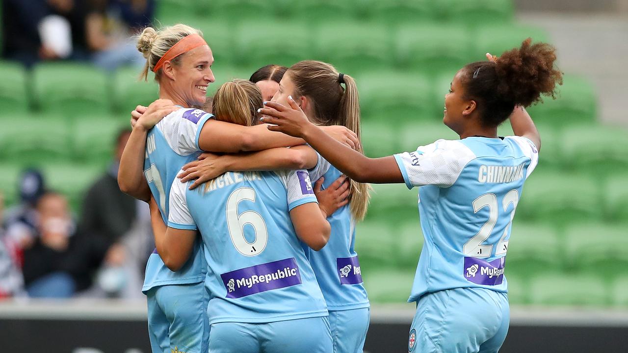 Teammates get around Wilkinson after she beats the keeper for one of her five goals. Picture: Getty Images