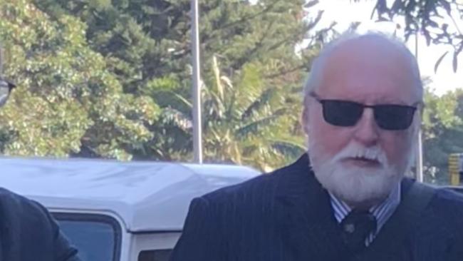 Christopher Hardy (right in sunglassses), 65, of Seaforth, a teacher at St Augustine's College Brookvale, outside Manly Local Court on August 9, 2023, where he pleaded not guilty to common assault of a male student. The charge was dismissed. Picture: Jim O'Rourke