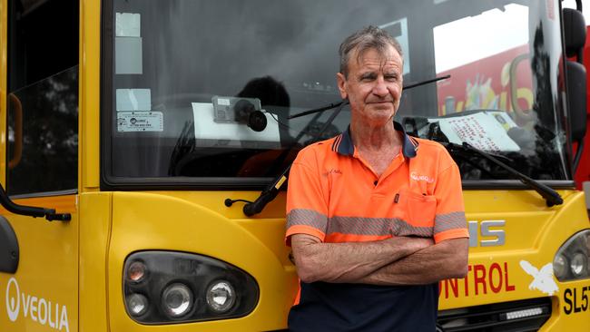 Veolia waste and recycling driver Paul Senior outside his truck which carries the AI-modified iPhone camera developed by TechnologyOne. As he drives all information is sent automatically to council. Picture: Jane Dempster.