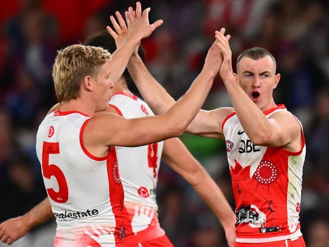 MELBOURNE, AUSTRALIA - MAY 23: Isaac Heeney and Chad Warner of the Swans celebrate a goal during the round 11 AFL match between Western Bulldogs and Sydney Swans at Marvel Stadium, on May 23, 2024, in Melbourne, Australia. (Photo by Morgan Hancock/Getty Images)