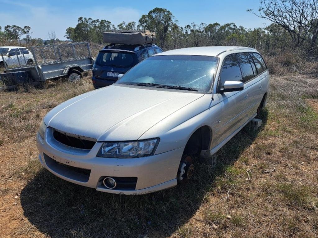 Unregistered, five door wagon, silver Holden Commodore.