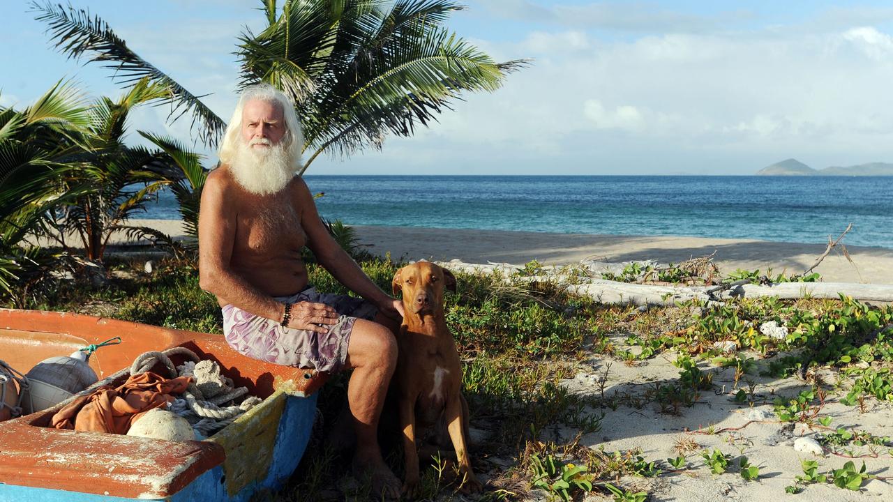 David Glasheen, pictured with his dog Quasi, on Restoration Island in 2009. Picture: Brian Cassey