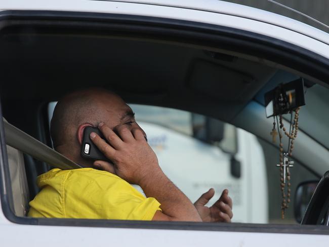 Mobile phone laws while driving mean nothing to this guy on King Georges rd .pic John Grainger