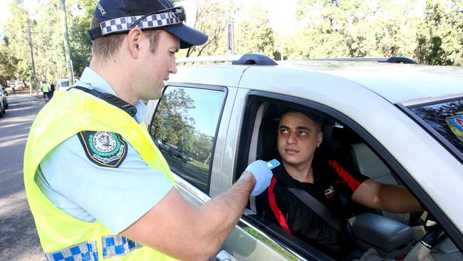 Daniel Maglovski undergoes a test at the launch of Operation Merrett on Henry Lawson Drive on Monday. Picture: Justin Sanson