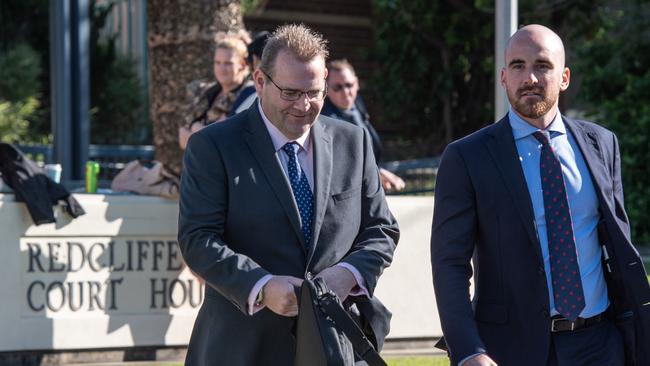 Former Tasmanian politician Adam Brooks with his lawyer Brendan Beavon at Redcliffe Magistrates Court. PICTURE: Brad Fleet