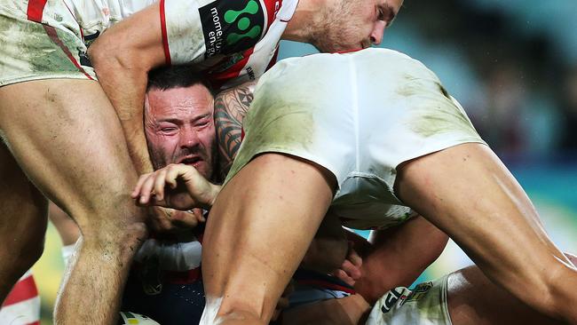 Bottoms up and Rooster Boyd Cordner is crunched in a Dragon sandwich at Allianz Stadium. Picture: Phil Hillyard