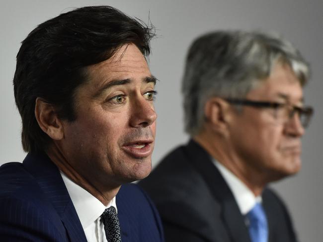 AFL CEO Gillon McLachlan (left) and Chairman Mike Fitzpatrick speak to the media at AFL House in Melbourne, Tuesday, Jan. 12 2016. WADA today found 34 past and present Essendon AFL players guilty of using performance enhancing drugs. (AAP Image/Julian Smith) NO ARCHIVING