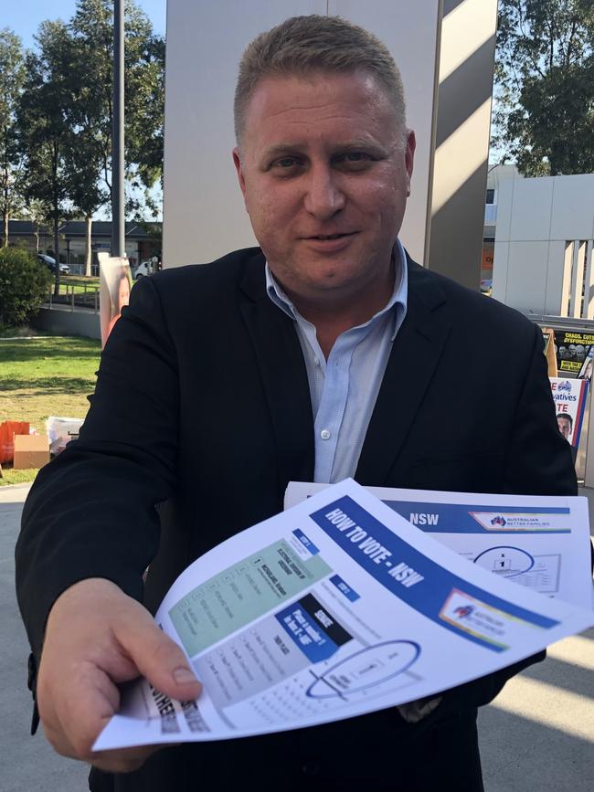 Australian Better Families candidate Graham McFarland hands out how-to-vote flyers at the Stanhope Gardens polling centre. Picture: Kate Lockley