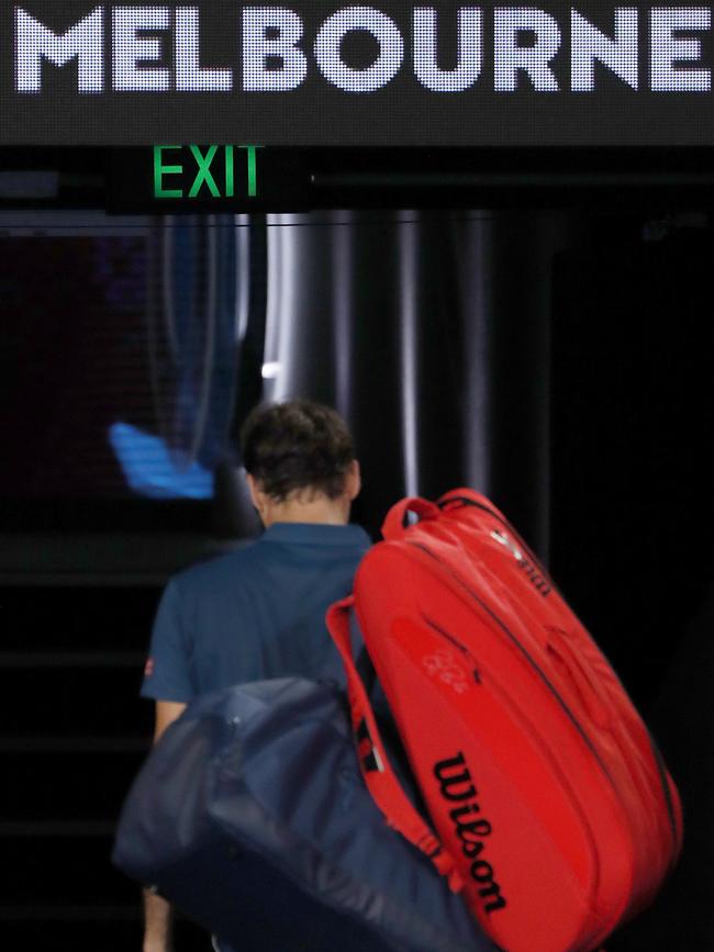 Roger Federer of Switzerland exits Rod Laver Arena after losing in his fourth round match against Stefanos Tsitsipas of Greece.