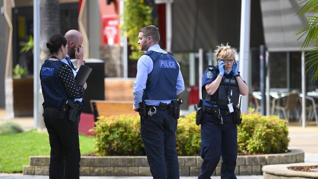 Police and detectives outside Elizabeth City Centre after the stabbing on Wednesday. Picture: Picture Mark Brake