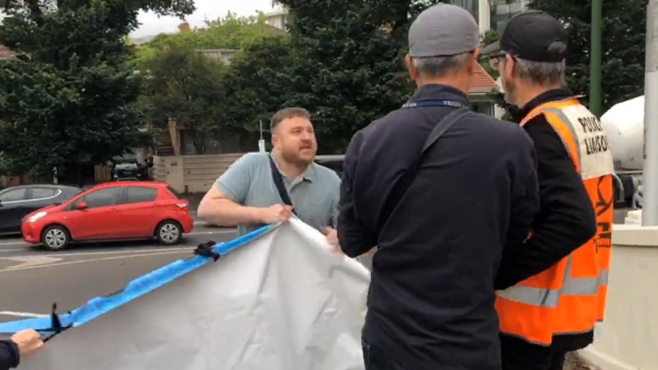 Angry driver rips sign off climate protesters who caused traffic chaos