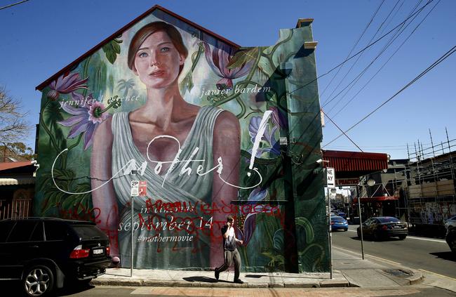 Residents are outraged that a Newtown street mural on Enmore Rd has been painted over for a Hollywood movie ad. Picture: John Appleyard