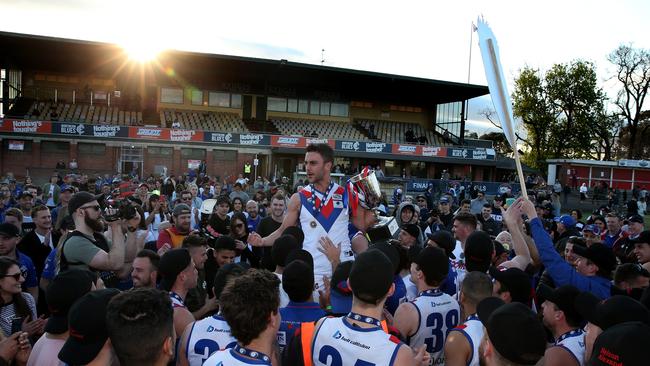 West Preston-Lakeside captain Nathan Valladares is hoisted onto the shoulders of supporters.