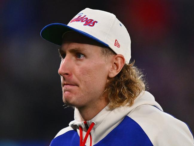 MELBOURNE, AUSTRALIA - MAY 23: Aaron Naughton of the Bulldogs walks back to the bench after receiving an injury during the round 11 AFL match between Western Bulldogs and Sydney Swans at Marvel Stadium, on May 23, 2024, in Melbourne, Australia. (Photo by Morgan Hancock/Getty Images)