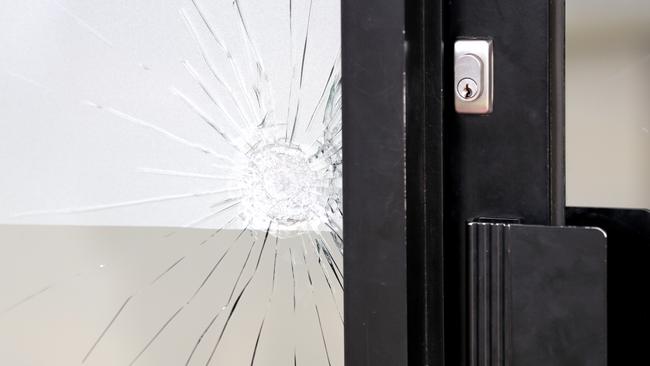 A bullet travelled into the parlour and through two internal walls. Picture: Alex CoppelA business’s window was shattered. Picture: Alex Coppel