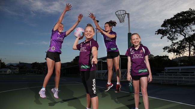 Junior netballers Bella Grace, 12, Shelby Smith, 12, Emily Grace, 14, and Sami-Lee Smith, 13, on court in Cairns. PICTURE: BRENDAN RADKE