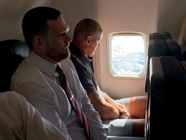 06/12/2018: 70 year old Chris Dawson is escorted by NSW Police whilst being flown from Queensland to NSW to face charges of murder over the death of his wife Lyn Dawson. PIC: Lyndon Mechielsen/ The Australian